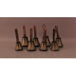 A set of eight Victorian hand bells, by J. Shaw, Son & Co. of Bradford, of graduated sizes the