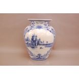 A large 20th century Delft blue and white pottery vase, 36cm, with painted river landscape, with a