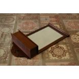 An Edwardian mahogany wall mirror, 87cm high, with candle box