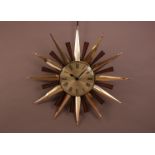 A modern metal sunburst wall clock, by Metamec, AF 58cm high