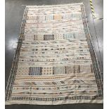 A 20th century light coloured kilim rug, possibly Greek or Cypriot, 289cm x 188cm