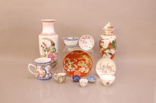 A large collection of Oriental porcelain, including two vases; one with a cover 34cm high, a Chinese