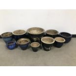 A group of ten blue glazed pottery garden pots, varying sizes and some with bamboo design, largest