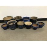Ten blue glazed pottery garden pots, tallest 25cm high and 30cm diameter, along with another damaged