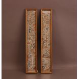 A pair of 20th century silk far eastern panels, 58cm x 10cm