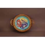 A late 19th century French Majolica ceramic dish with bird decoration, in a gilt metal mount with