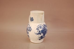 A Caughley blue and white transfer printed jug, C.1790. with mask head spout, marked to the base