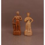 A pair of 19th century saltglazed ceramic decanters, of Queen Victoria and Prince Albert, 29.5cm and