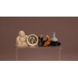 Four works of art, comprising, a hardstone figure of a buddha 6.5cm high, a portrait miniature of