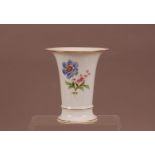 A late 19th century porcelain Meissen trumpet vase, floral design with gilt rims, marked to the