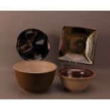 Two large studio pottery bowls, 31cm and 27cm in diameter, together with a glazed plate by D.