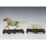 Two 20th century Chinese carved green hardstone horse figures, one example seated on a hardstone
