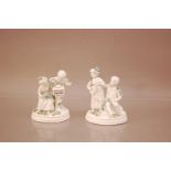 A pair of 20th century porcelain Dresden figural groups, 14.5cm and 15.5cm high, white with coloured