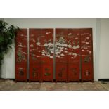 A mid 20th century Japanese lacquered six panel room divider, each nicely carved panel 181cm high