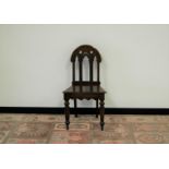 A Victorian carved mahogany Gothic influenced hall chair