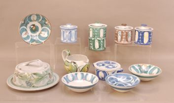 A collection of Aldermaston pottery, comprising; four bowls, three small jars, 11cm high with lids