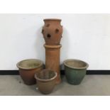Five garden ornaments and pots, including a terracotta chimney pot, 62cm, a strawberry planter,