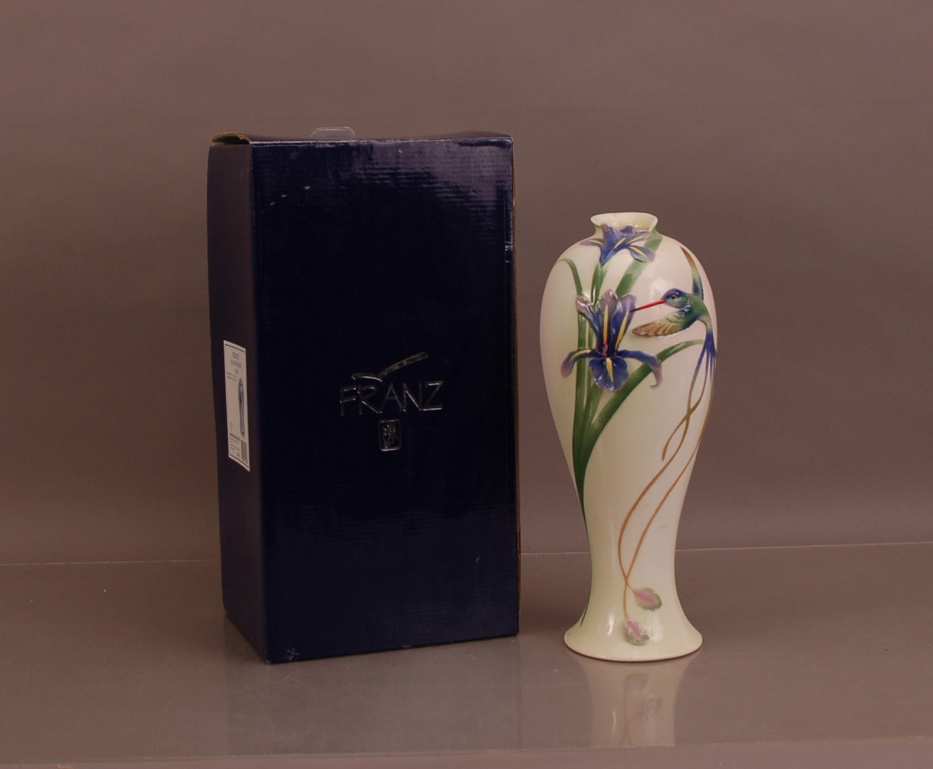 A large Franz porcelain vase, 36cm high with its retail box (2)