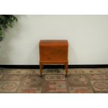 A 20th century mahogany and boxwood inlaid cellarette, domed top revealing a fitted interior, raised