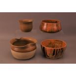 Four studio pottery bowls by Eve Beardsley, two partially glazed with pinched rims, the largest 12.