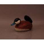A 20th century wooden carved 'Ruddy Duck' decoy duck, by Wil Birk, glass eyes, the tail broken and