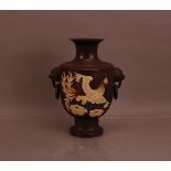 A 20th century Japanese terracotta twin handled vase, depicting a dragon on one side and a bird on