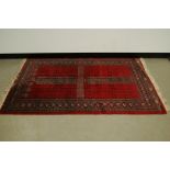 A late 20th century Middle Eastern woollen carpet, 180cm by 125cm