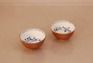 Two 18th century Chinese blue and white and Café-au-lait porcelain bowls, 8.5cm diameter, some