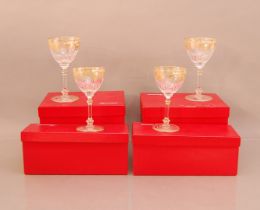 Four Baccarat glasses, in their Baccarat boxes (one AF), gilt scrolling design 16.5cm high (4)