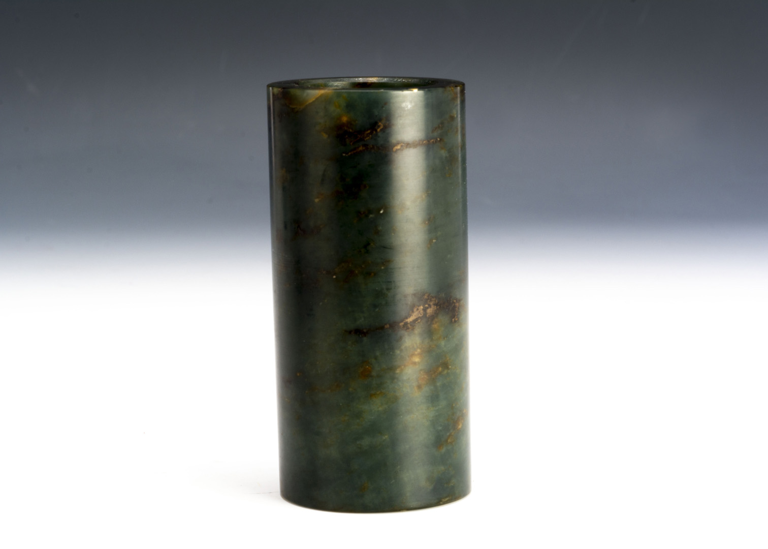 An early 20th century Nephrite Jade Chinese ink pot or small vase, with some inclusions plain