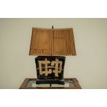 A c1970s Japanese studio pottery lamp base, 59cm high, with bamboo shade