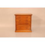 A Victorian mahogany apprentice/miniature chest of draws, moulded top edge above four graduated