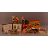 A mixed lot of collectables, including three monkey toys, board games, Victorian photo album,