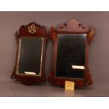 Three 19th century fret work wall hanging mirrors, the largest 87cm in length, two mahogany