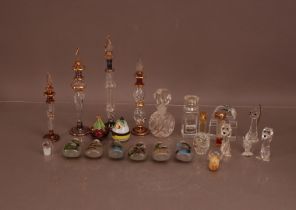 Four early 20th century perfume bottles with lids, together with a group of modern far eastern snuff