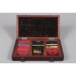 An early to mid-19th Century Mahogany Case of Paper-Covered Microscope Slides, of small size, each