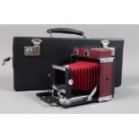 A Red VN Quarter Plate Technical Camera Body, made by Van Neck London, serial no D108, red leather