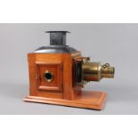 A late 19th Century Butcher & Son Mahogany and Brass Magic Lantern, with fielded door, now fitted