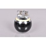 A Ronson Rondelight Ball table lighter, in black and cream lacquered finish, circa 1950s, unused,