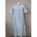 A vintage nurse's uniform, named S L de Hailes, to inner collar, in pale blue, with poppers to the