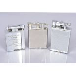 Three petrol pocket lighters, comprising a Dunhill 'New' lighter, silver plated with flint wheel