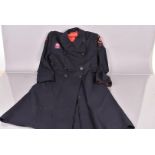 A War Period Red Cross overcoat for Buckingham, the dark blue overcoat with VAD First Aid &