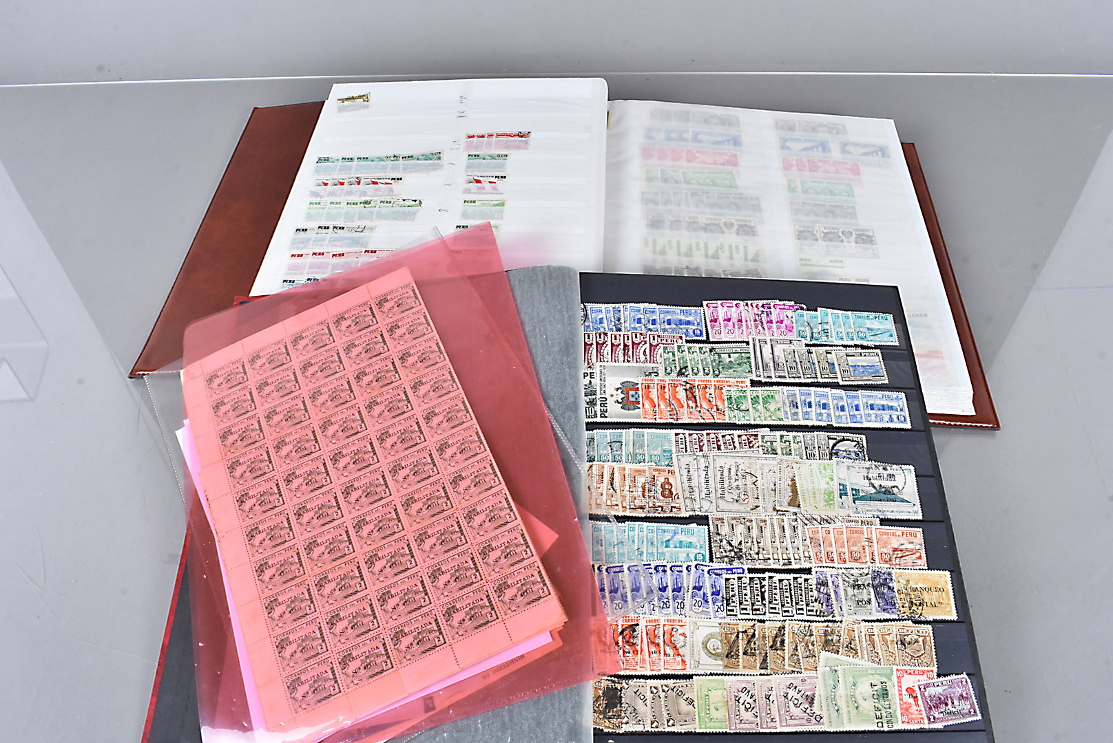 A collection of Peru Stamps, various ages, in two stock books, loose and sheets, a large amount of