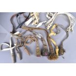 An assortment of sword knots and hangers, including various bullion examples of different designs,