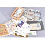 An assortment of British and Overseas stamps and FDCs, including a quantity of South African