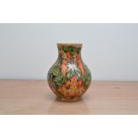 A Moorcroft pottery vase, Forest fire Flame pattern, 1997, 24cm high