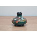 A Moorcroft pottery squat vase, Strawberries' pattern, 1996, 9.5cm high