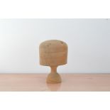 An early 20th century wooden wig or hat stand, stamped 22 1/2, splits inot two parts, AF, 26cm high
