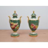 A pair of Fine Bone China twin handled urns with covers, by J. Mottram (signed on the lids) with