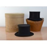 A Boxed silk top hat by W.J. Scotty Co. Ltd., together with a n Opera top hat by West & Co., all
